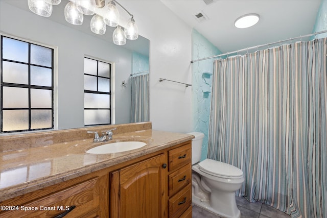 bathroom with tile patterned floors, vanity, a shower with shower curtain, and toilet