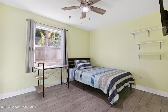 bedroom with wood-type flooring and ceiling fan