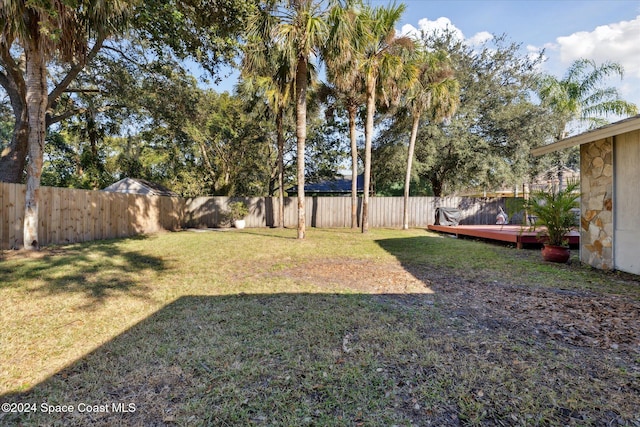 view of yard featuring a wooden deck