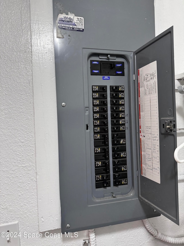 utility room featuring electric panel