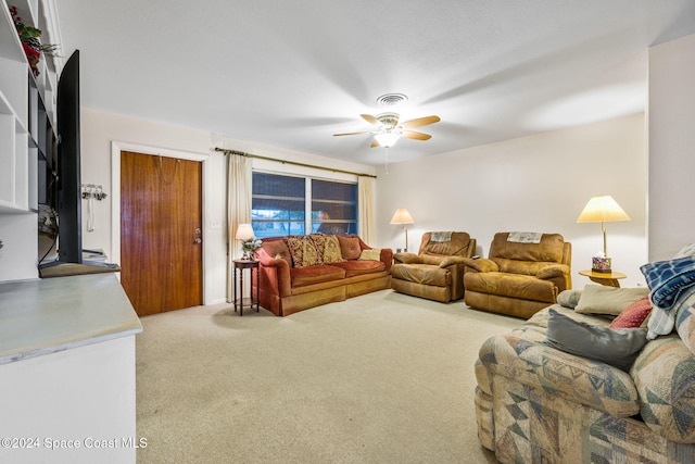 carpeted living room featuring ceiling fan