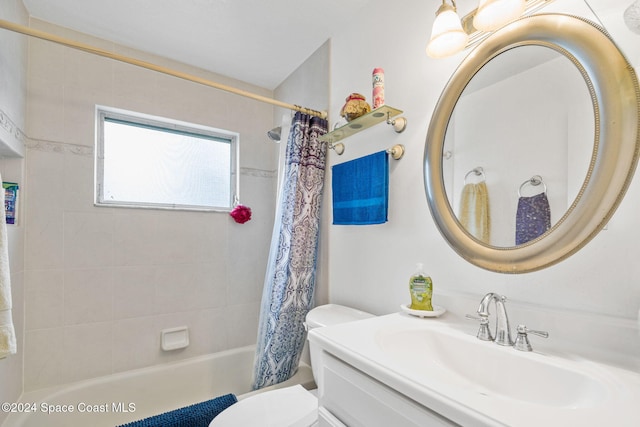 full bathroom featuring shower / bath combo, vanity, and toilet