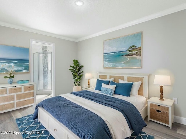 bedroom with light wood-type flooring and crown molding