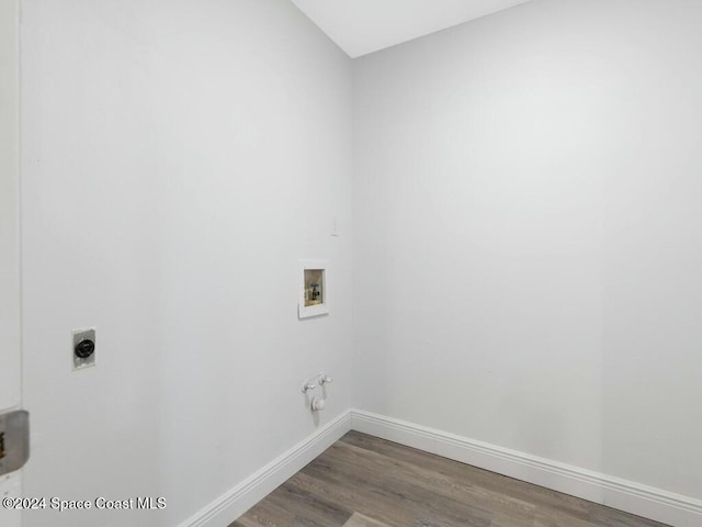 washroom with electric dryer hookup, hookup for a gas dryer, washer hookup, and hardwood / wood-style flooring