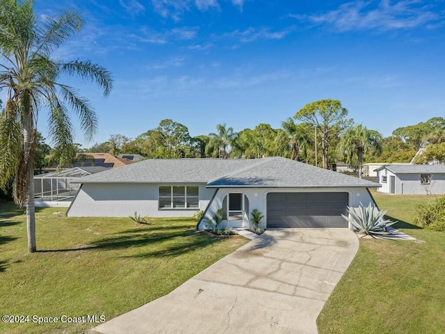 single story home featuring a garage and a front yard