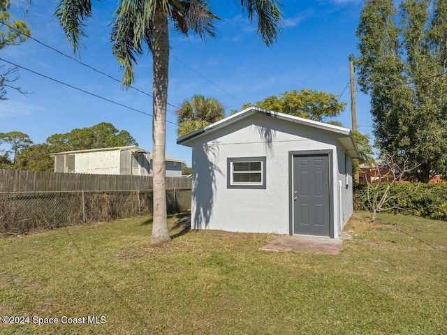 view of outdoor structure with a yard