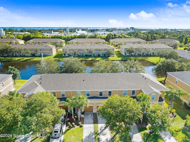 bird's eye view featuring a residential view and a water view