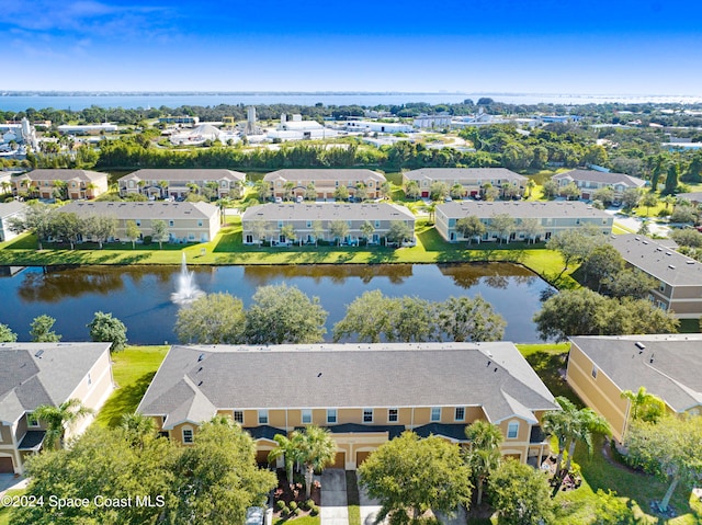 birds eye view of property with a water view and a residential view