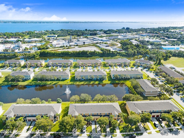 drone / aerial view with a residential view and a water view