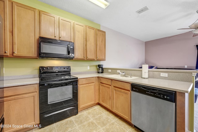 kitchen featuring kitchen peninsula, sink, light tile patterned floors, and black appliances