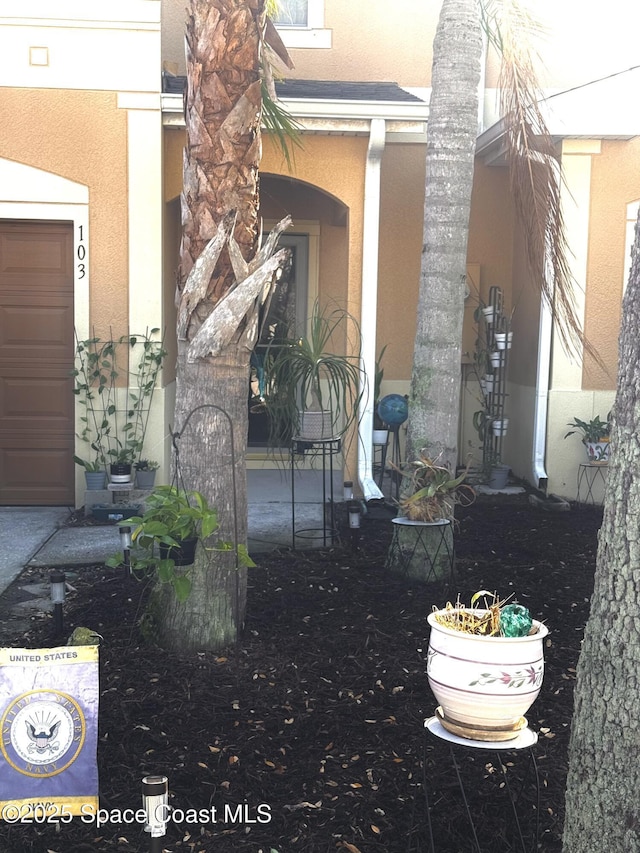 exterior space featuring stucco siding