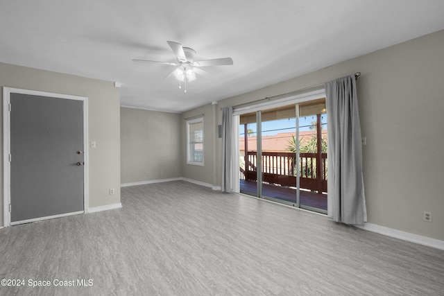 spare room with ceiling fan and light hardwood / wood-style floors