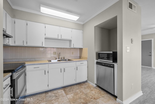 kitchen with appliances with stainless steel finishes, backsplash, wall chimney range hood, sink, and white cabinetry