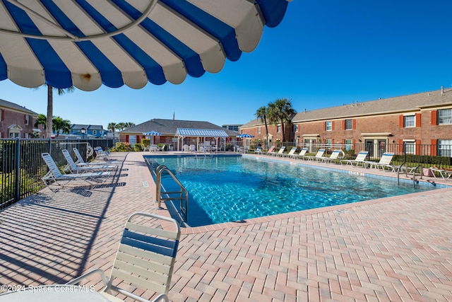 view of swimming pool featuring a patio