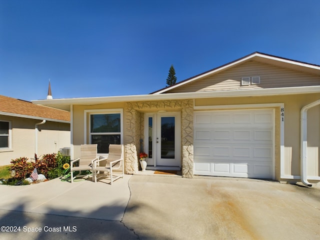 ranch-style home with a garage