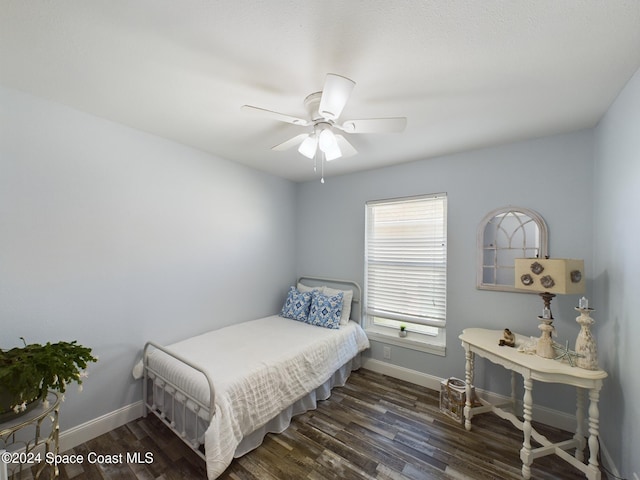 bedroom featuring ceiling fan and dark hardwood / wood-style flooring