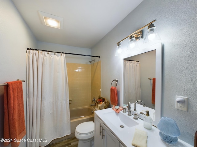 full bathroom featuring shower / tub combo with curtain, vanity, hardwood / wood-style floors, and toilet