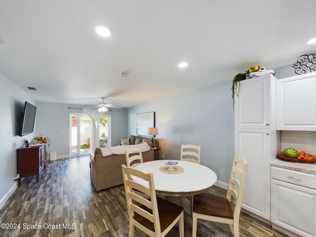 dining area featuring ceiling fan and dark hardwood / wood-style flooring