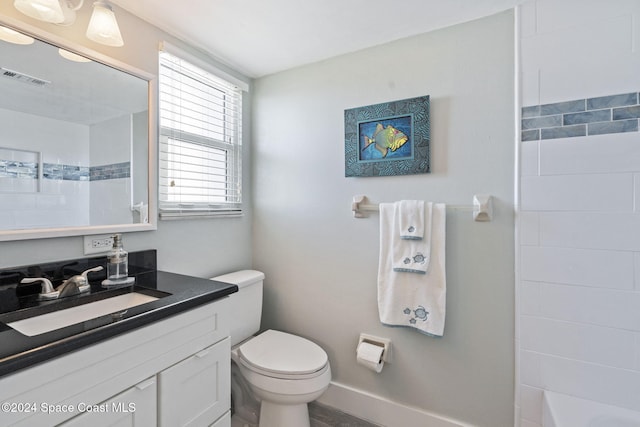 bathroom with vanity and toilet