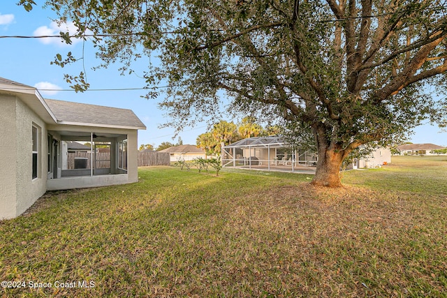 view of yard featuring a lanai