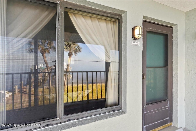 doorway to property featuring a balcony