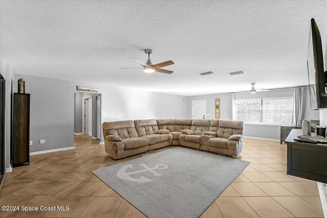 tiled living room with a textured ceiling