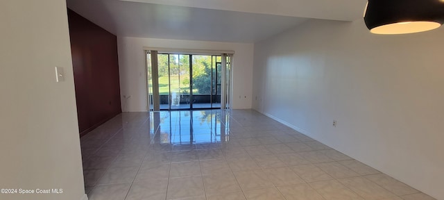 spare room with light tile patterned floors