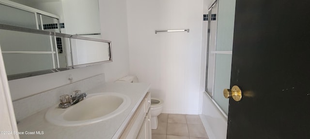 full bathroom with tile patterned floors, vanity, enclosed tub / shower combo, and toilet