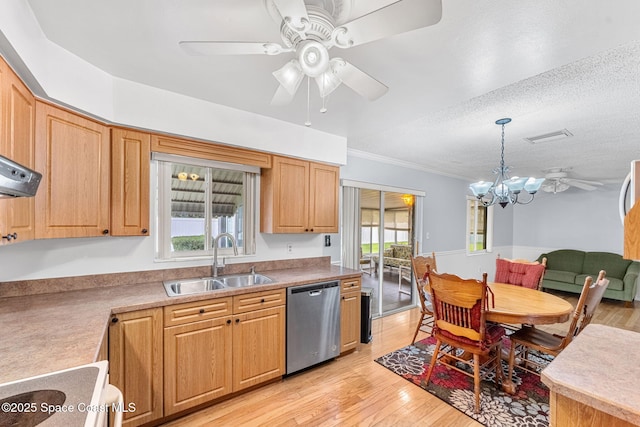 kitchen featuring dishwasher, sink, hanging light fixtures, light hardwood / wood-style floors, and a textured ceiling