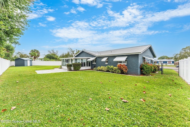 view of front of home with a patio area and a front yard