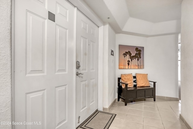 foyer entrance with light tile patterned flooring