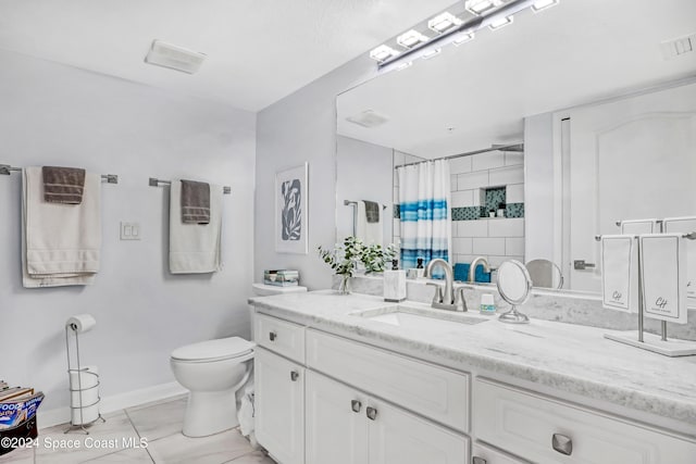 bathroom with walk in shower, vanity, and toilet