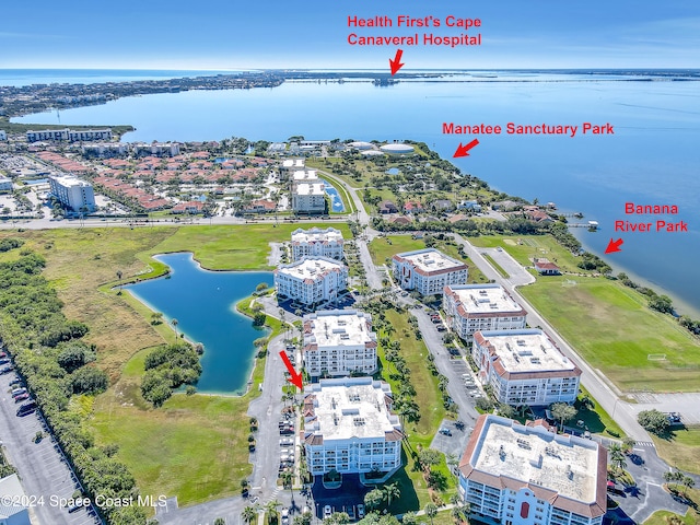 birds eye view of property with a water view