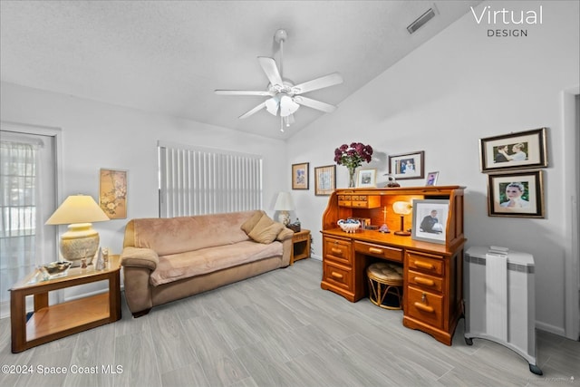 home office featuring ceiling fan, light hardwood / wood-style flooring, high vaulted ceiling, and a textured ceiling