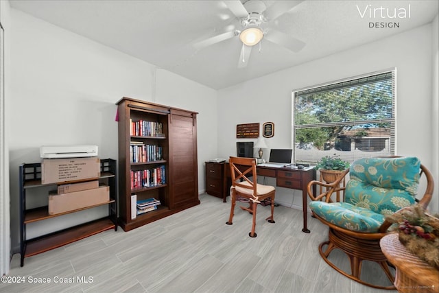 home office with ceiling fan and light wood-type flooring