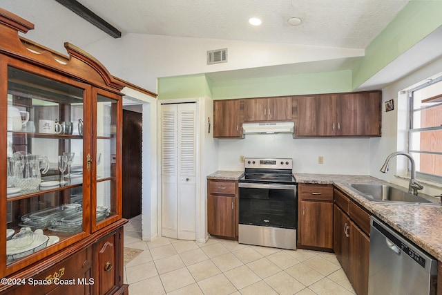 kitchen with sink, lofted ceiling with beams, a textured ceiling, and appliances with stainless steel finishes