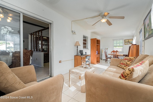 living room with ceiling fan and light tile patterned floors