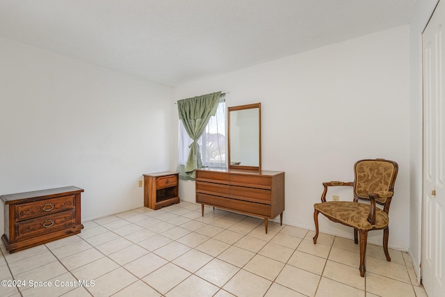 living area with light tile patterned floors