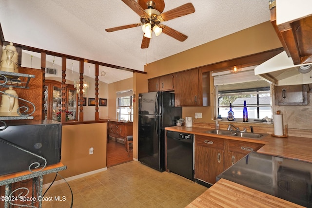 kitchen with black appliances, lofted ceiling, sink, and a textured ceiling