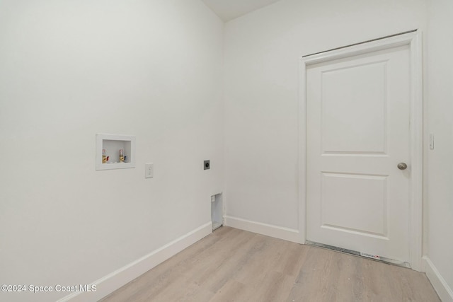 washroom featuring electric dryer hookup, light hardwood / wood-style flooring, and washer hookup