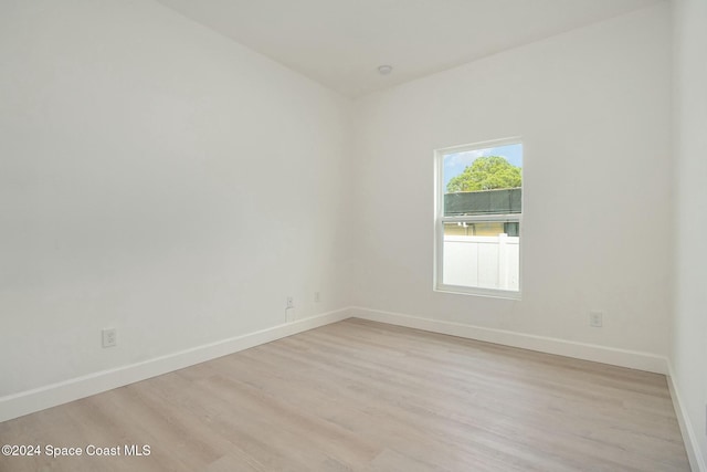 spare room with light hardwood / wood-style floors