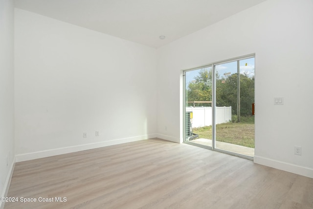 spare room featuring light wood-type flooring