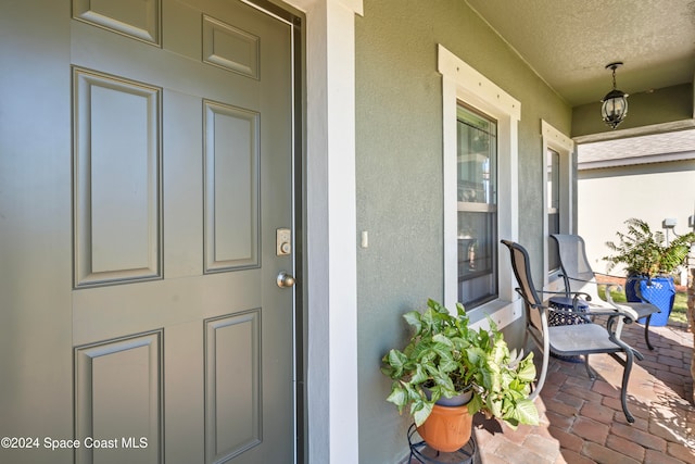 entrance to property featuring covered porch