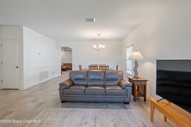 living room featuring an inviting chandelier