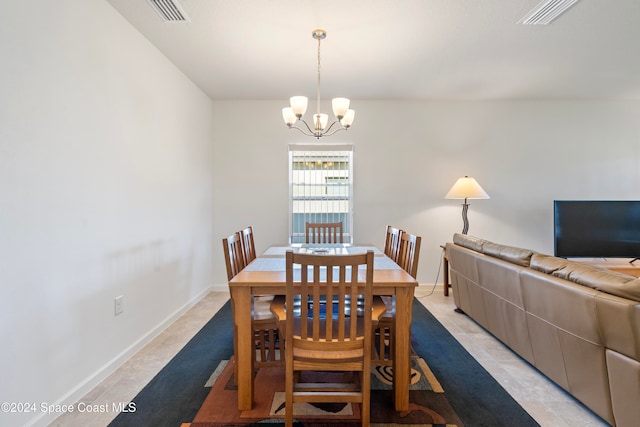 dining area featuring a chandelier