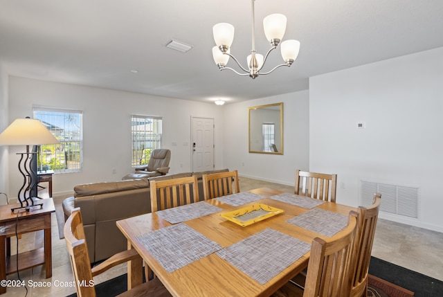 dining room featuring a chandelier