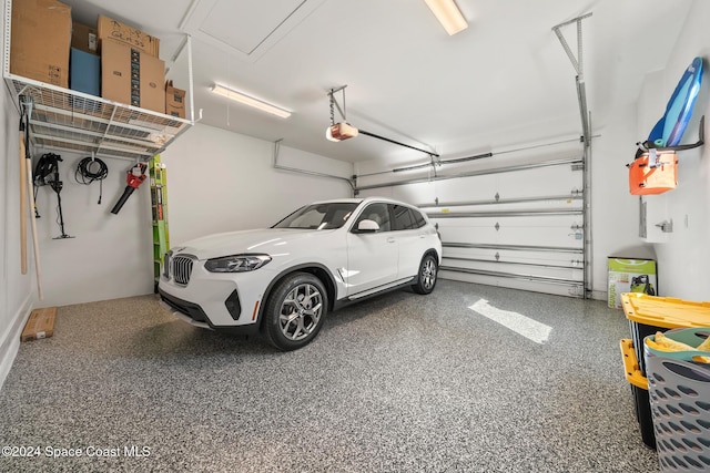 garage featuring a garage door opener