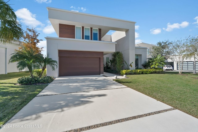 modern home with a front yard and a garage