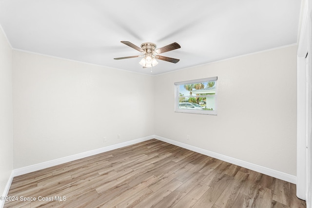 empty room featuring light hardwood / wood-style floors, ceiling fan, and ornamental molding