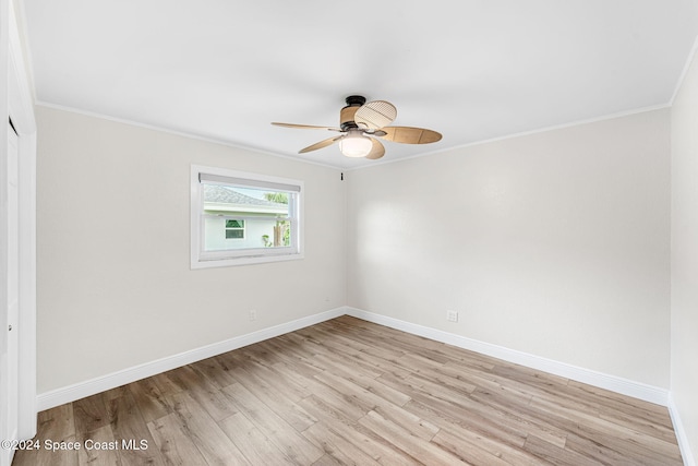 unfurnished room featuring ceiling fan, light hardwood / wood-style flooring, and ornamental molding